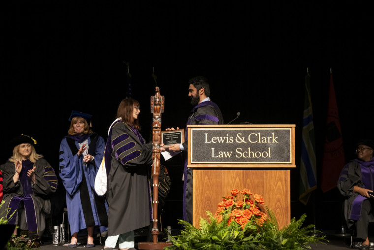 Harpreet S. Dhaliwal presents Professor Sandy Patrick with the Leo Levenson Award for Excellence in Teaching