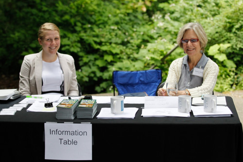 NCVLI Intern Renee Huizinga and a Conference volunteer staff the Information Table. Photo by Chris Wilson.
