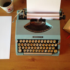 Typewriter and coffee cup