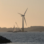 The world's first full-scale floating wind turbine, the 2.3 MW Hywind, being assembled in the Åmøy Fjord near Stavanger, Norway in 2009...