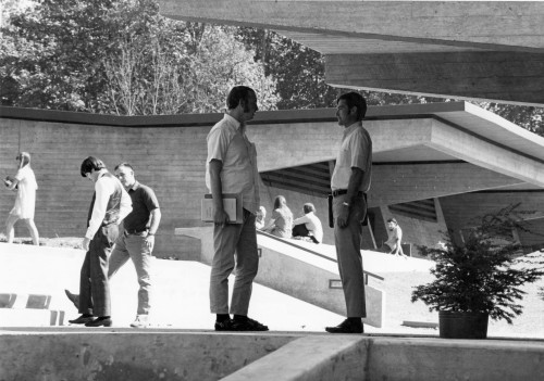 Students chat on the newly built law school campus, 1970. The Chester McCarty Classroom Building, named in honor of a 1938 graduate, is s...