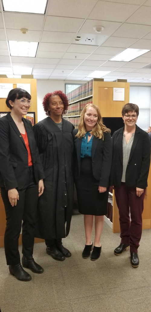 Clinic students Sara Densmore, Amber Cognata and Michelle Gamow-Jones with Multnomah County Circuit Judge Patricia McGuire at Legal Servi...