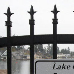 A sign indicates restricted access to Oswego Lake in Lake Oswego.