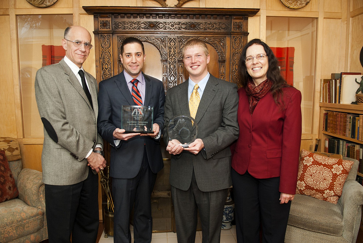 The Lewis & Clark School of Law Negotiation Team, Nathan Morales and Matthew Ring (shown here with Dean Robert Klonoff and their coac...