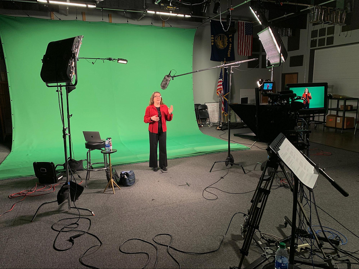 Lydia Loren in front of green screen.
