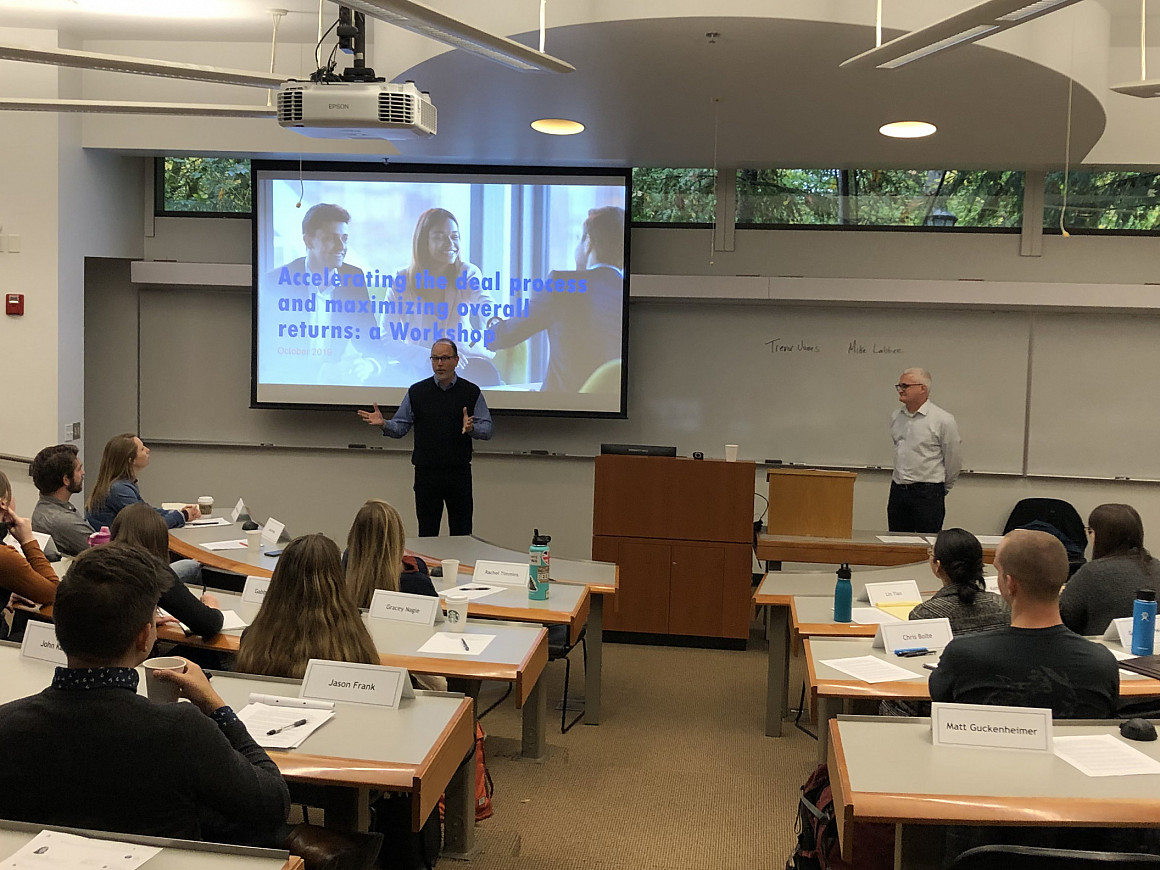 Intel executives Trevor Jones and Michael Labbee presenting to students.