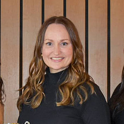 Kristina with three other students at an award ceremony.