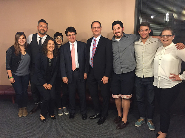 Strang and Buting pose with Professor Kaplan and students