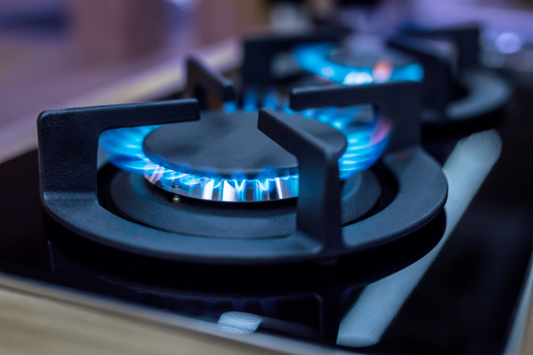 Stove. Cook stove. Modern kitchen stove with blue flames burning.