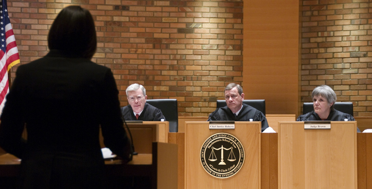 Third-year law student Meredith Price argues her case in front of Judge O'Scannlain, Chief Justice Roberts, and Judge Brown.