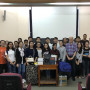 Professor Klonoff with 240 pounds of donated law casebooks, and his Cambodian students.