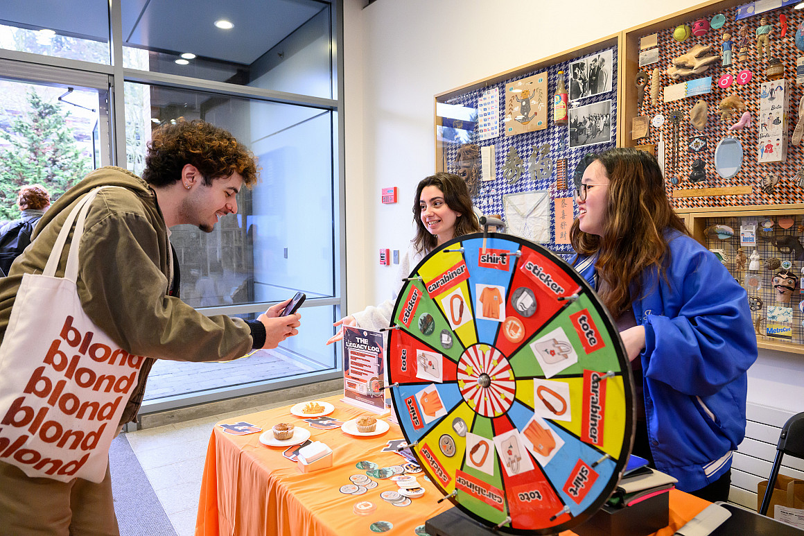 Students spin the prize wheel at the Days of Giving Festival in JR Howard.
