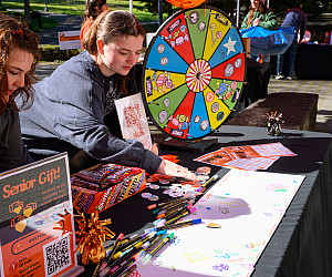 Students spin the prize wheel at last year's Day of Giving festival.