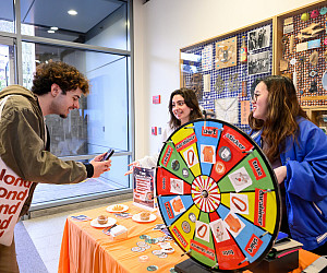 Students spin the prize wheel at the Days of Giving Festival in JR Howard.