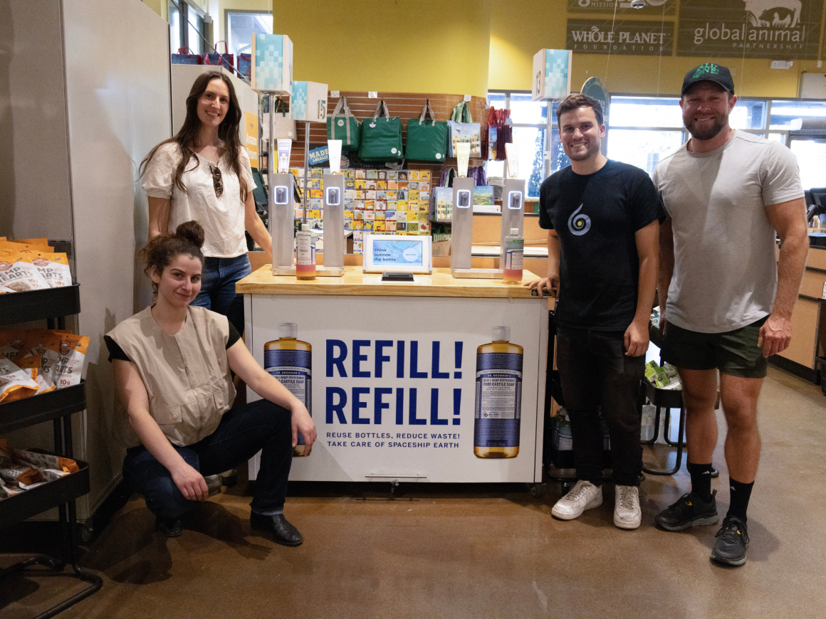 The Wonderfil team with a dispenser station.