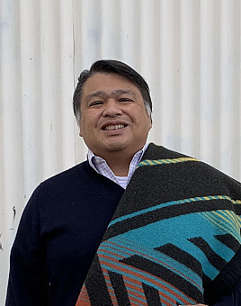 Jeremy Aliason with ceremonial blanket