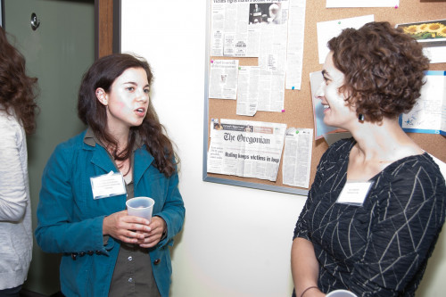 NCVLI Volunteer Coordinator Johanna Borkan discusses pro bono opportunities with Open House guests