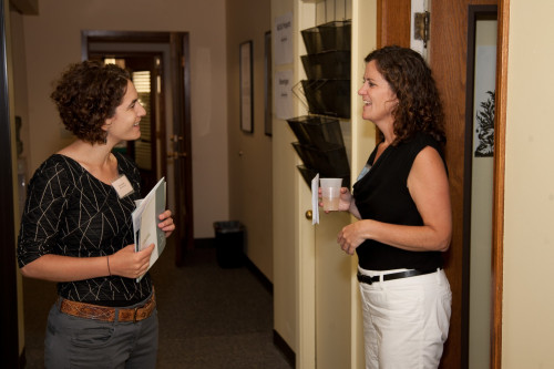 NCVLI Executive Director Meg Garvin greets Open House guests
