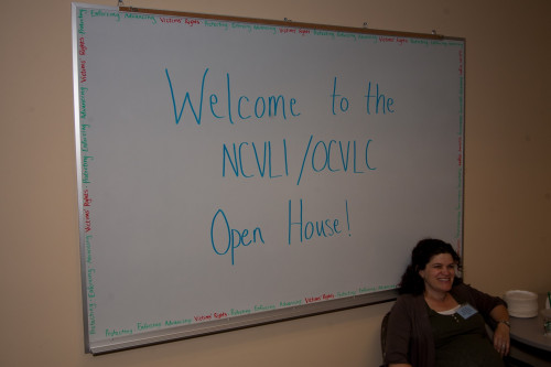 NCVLI Legal Publications Director Sarah LeClair greets Open House guests