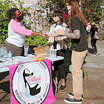 Founder Nikeisah Newton serves food outdoors.
