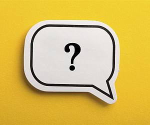 Image of a question mark in the center of a speech balloon.