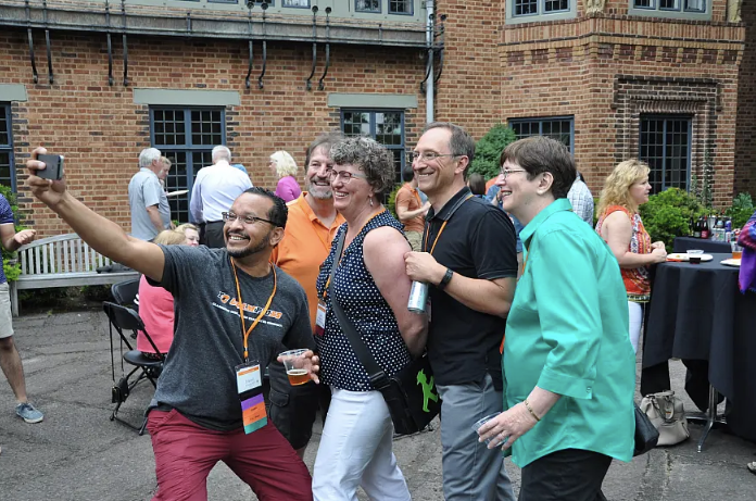 Alumni taking selfies at Alumni Weekend
