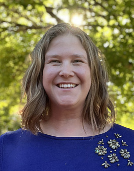 Photo of Chelsea Ellis with tree in background