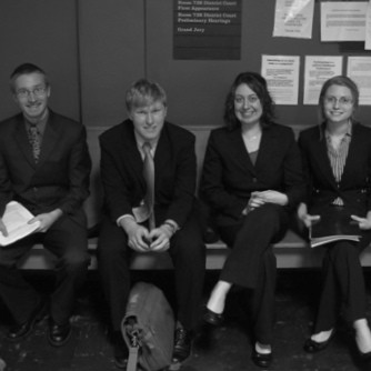 Outside the courtroom waiting to argue.  I'm in the middle next to my opponent, Andy.  My partner, Sam, is far left.