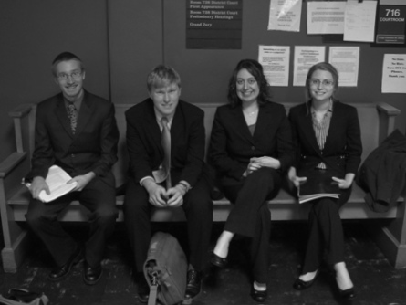 Outside the courtroom waiting to argue.  I'm in the middle next to my opponent, Andy.  My partner, Sam, is far left.
