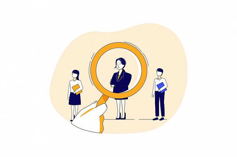 Looking at a job candidate with a magnifying glass
