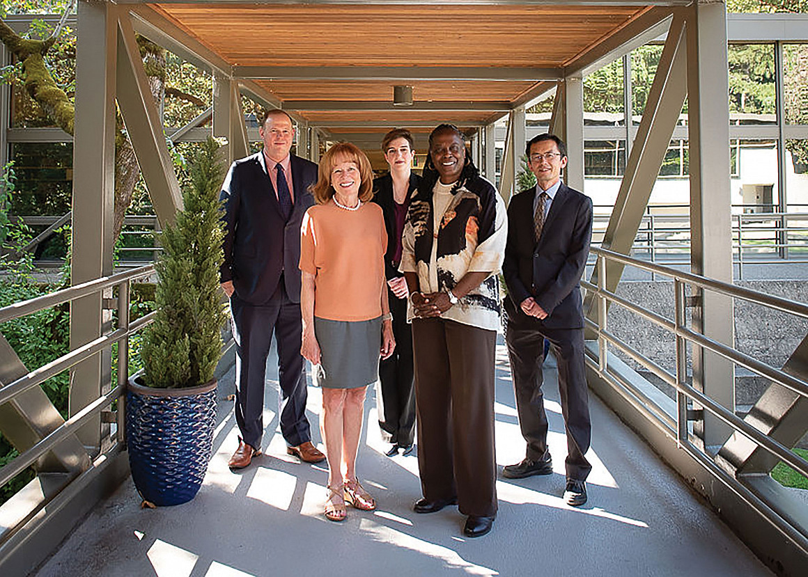 Members of the law school alumni board Brad Krupicka '10, Elli Tillotson '16, and Jie Lian '20 join Dean Johnson in welcoming President R...