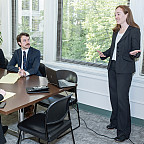 LITC Director and Professor Sarah Lora speaking with clinic students.