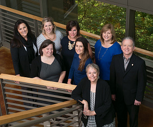 Back row: Joset Grenon, Liz Becker, Tracy Sullivan '00, Libby Davis '93, and David Carter  Front row: Sarah Petersen '08, Suraya Barbee '...