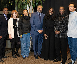 Jacqueline Alexander '07 and Lee Matthews BS '71, JD '73 with their children and Dean Johnson, Jared Bartie, and President Holmes-Sullivan.