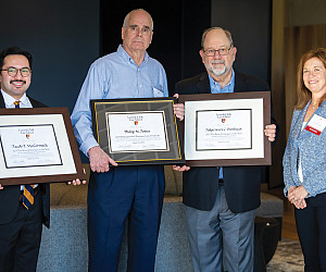 (L to R) Distinguished Business Law Graduate Jacob McCormack, Philip Jones,Judge Henry Breithaupt, and Dean Alicia Ouellette.