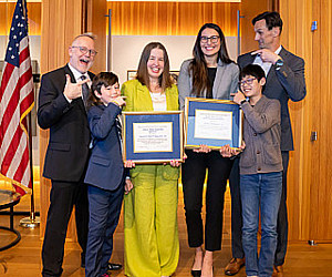 Kristen West McCall '06, Katie Jahangiri '26 and their families.