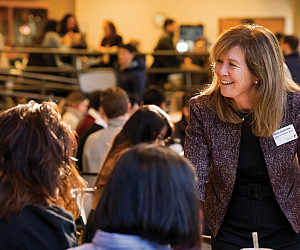 Dean Alicia Ouellette chats with law students.