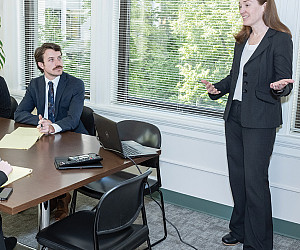 LITC Director and Professor Sarah Lora speaking with clinic students.