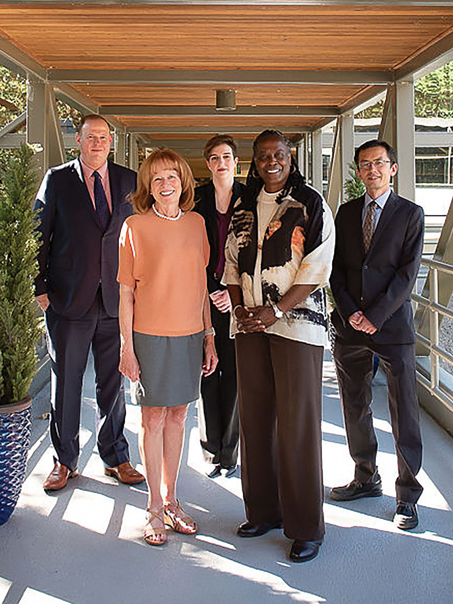 Members of the law school alumni board Brad Krupicka '10, Elli Tillotson '16, and Jie Lian '20 join Dean Johnson in welcoming President R...