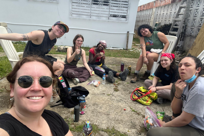 A group of volunteers takes a break for lunch after working with SBP to repair a house that was damaged after recent hurricanes.