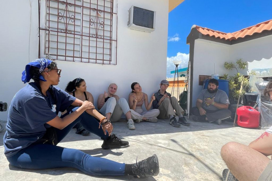 The volunteer group takes a break to discuss contemporary social and economic issues with their partner SBP.