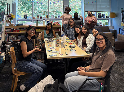 SACNAS members sitting at a table in the IME suite