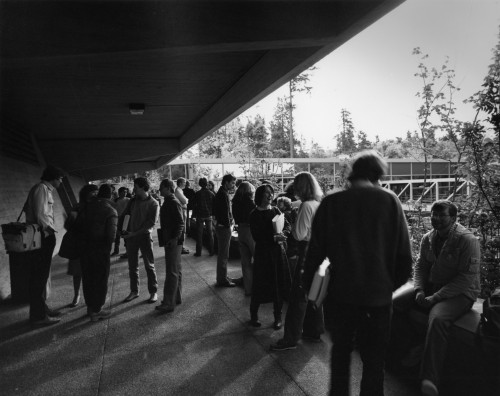 Students wait outside the Chester McCarty Classroom Building, 1981.