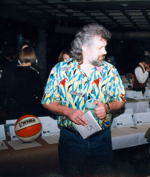 Professor Steve Johansen scans the items on offer at the PILP Auction, 1999.