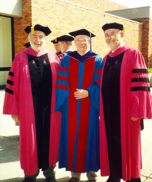 Professors Bill Williamson, Bernie Vail, and Doug Newell attend the 2001 commencement.