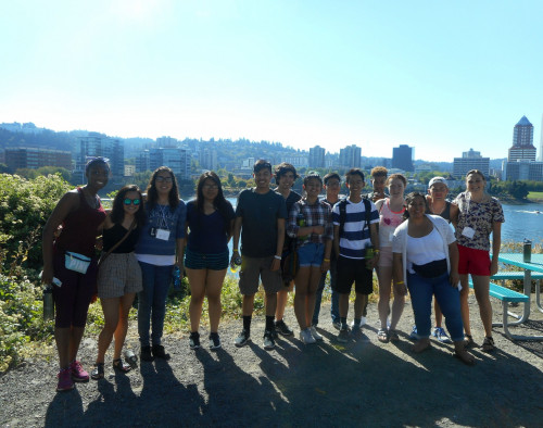 Students enjoy a picnic with a view of Portland.