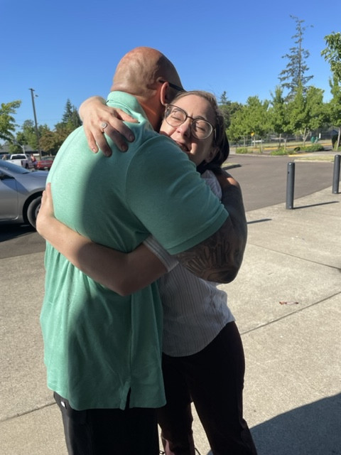Clinic student Maggie Powers with former client at his release from prison.