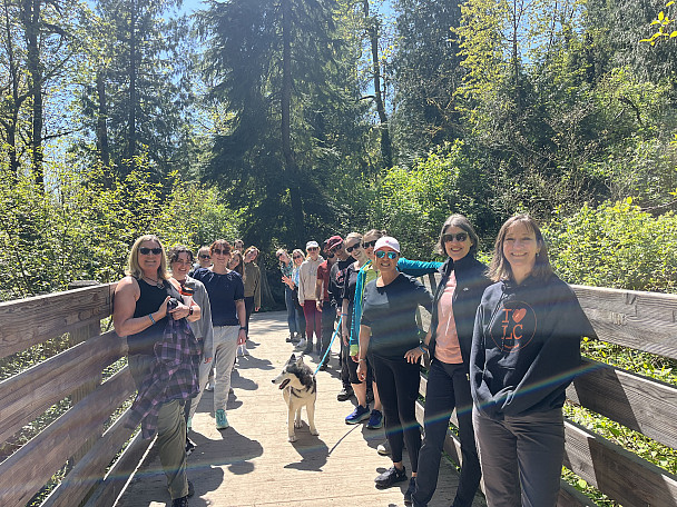 One L&C Earth Day hikers stop for a photo on a bridge in Tyron Creek State Park. 