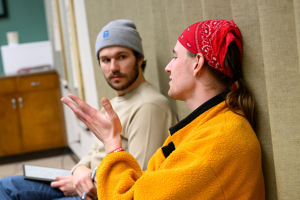 Two students talking with each other.