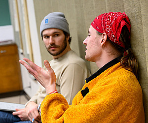 Two students talking with each other.